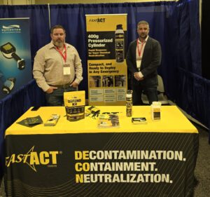 FAST-ACT team members showcasing FAST-ACT Products such as the FAST-ACT DEFEND Kit, FAST-ACT Pressurized Cylinders. and more.